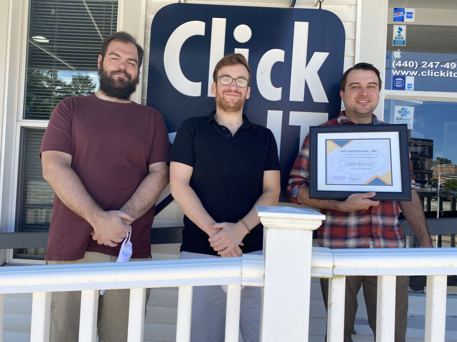 Click IT corporate store team members celebrating an award